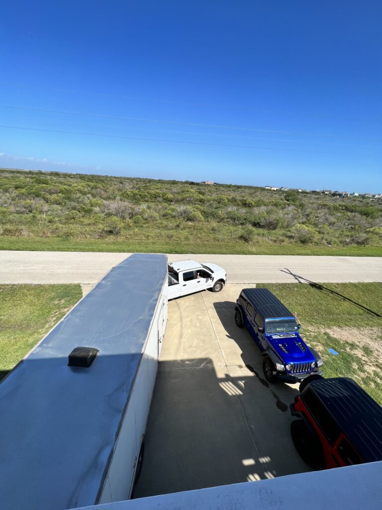 Movers loading moving truck at driveway